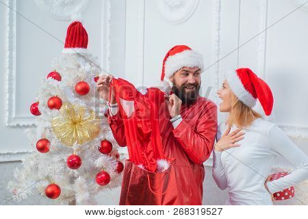 Happy Family Preparing To New Year. Christmas Holiday Party. Red Lingerie For Christmas Women. Santa