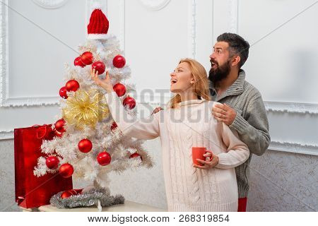 Happy Family Preparing To New Year And Merry Christmas. Christmas Tree White. Red And White Design