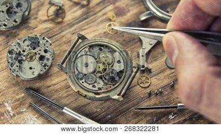 Watchmaker Is Repairing The Mechanical Watches In His Workshop