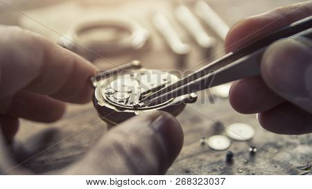 Watchmaker Is Repairing The Mechanical Watches In His Workshop