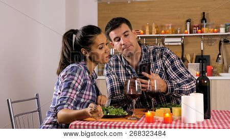 Happy Loving Couple Is Having Romantic Dinner At Home.