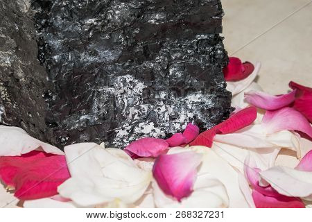 Stone In Rose Petals Background For Design Romance