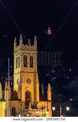Christ Church In Shimla Main Square With Jakhoo Hanuman Statue Upside In Background