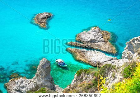 Fishing Yacht With Shadows On Bottom Sail Drift And Rubber Boat Park In Lagoon Blue Azure Turquoise 