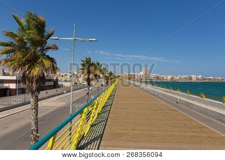 Torrevieja Pier Spain Also Known As Dique De Levante Breakwater With Marina And Port On One Side And