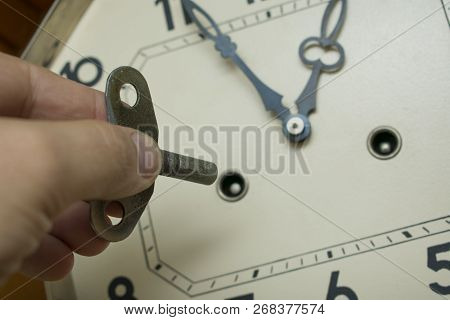 Wind Up The Watch Mechanism Of The Old Pendulum Clock, Close-up Dial