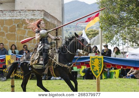 Tlaxcala, Mexico- September 29, 2018: Red Haired Warrior Woman Riding A Horse During Medieval Tourna
