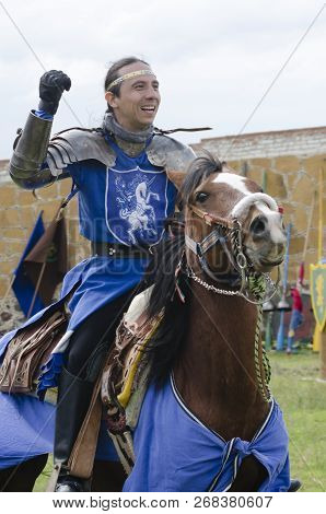 Tlaxcala, Mexico- September 29, 2018: Knight With Blue Clothes And Armor Riding A Horse And Smiling 