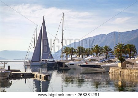 Beautiful Nautical Landscape With Luxury Yachts And Mountains