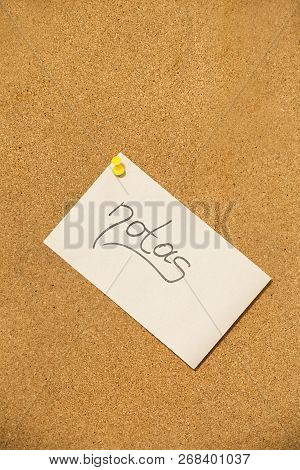 Notes On The Cork Board- Adhesive Note With Yellow Pin On Cork Board