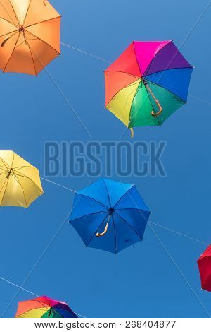 Multi Color Umbrellas Floating In Werfenweng, Austria