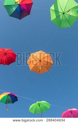 Multi Color Umbrellas Floating In Werfenweng, Austria