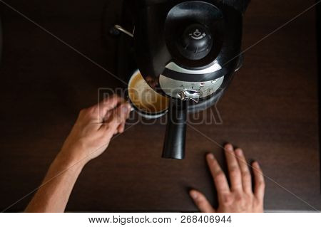 Photo Of Coffee Maker, Hands Of Man Pouring Coffee In Mug At Kitchen
