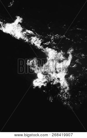 Black And White Abstract Close Up Image Of Flames Burning Hillside At Night During California Fire.