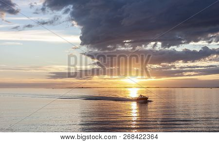 Amazing Sunset Over The Sea With Dramatic Clouds