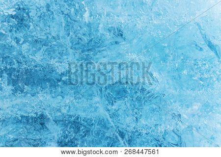 Blue ice texture, winter background, texture of ice surface, close-up.
