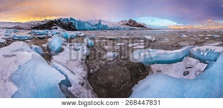 Famous Fjallsarlon glacier and lagoon with icebergs swimming on frozen water, southern Iceland, Europe.