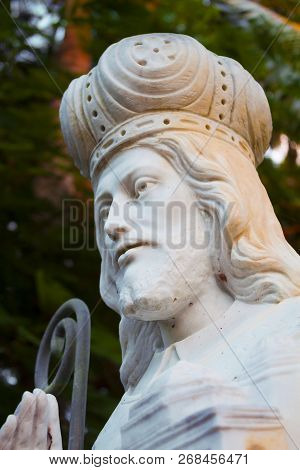 Community Catholic Church Courtyard With A White Stone Saint Coleman Religous Figure Close Up Right 
