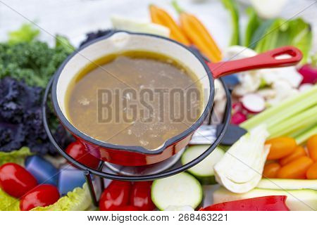 Traditional Italian Dish - Bagna Cauda. Hot Sauce And Raw Vegetables.