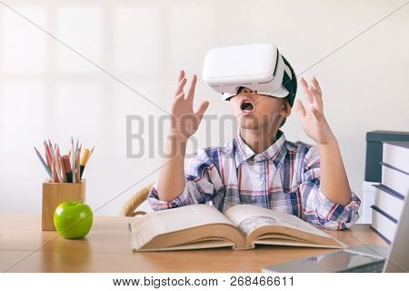 Young Boy Wearing A Vr Headset Experiencing The Frist Time Watched Virtual Reality. Education And In