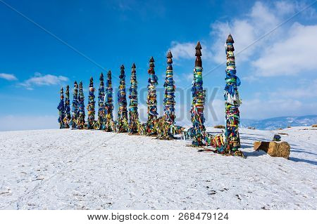 Wooden Ritual Pillars With Colorful Ribbons On Cape Burkhan, Lake Baikal, Olkhon Island, Siberia, Ru