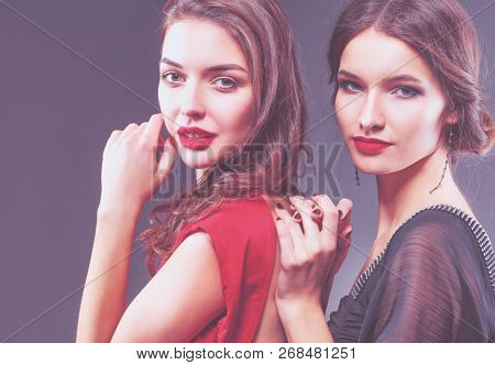 Two young beauty women standing together . Two young beauty wome