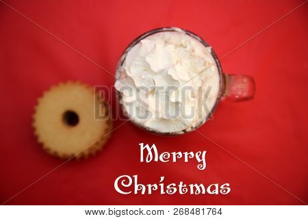 Hot Chocolate. Hot Coco in a glass mug with whip cream, cookies and text. Red Christmas background. Room for text