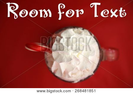 Hot Chocolate. Hot Coco in a glass mug with whip cream, cookies and text. Red Christmas background. Room for text