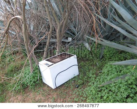 Abandoned Microwave Oven On Ground In Andalusian Village