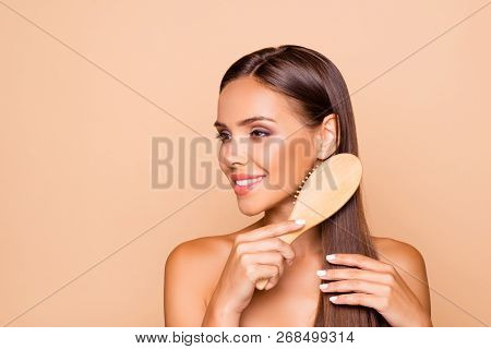 Portrait Of Charming Well-groomed Dreamy Brunette Hair Lady With Her Naked Shoulders She Combing Hai