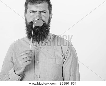 Man With Stylish Beard Holding Sensual Paper Lips. Bearded Man In Pink Shirt Frowning Isolated On Wh