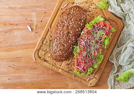 Salmon Sandwich - Smorrebrod With Cheese Cream And Microgreen On Wooden Table. Top View