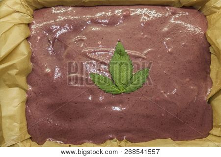 Cooking Of Marijuana Poppy Seed Cake With Chocolate And Pink Fruit Glaze
