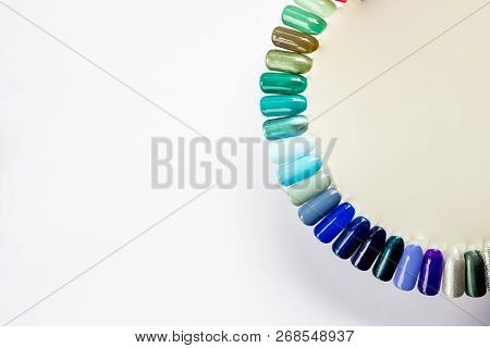 Nail Polish In Different Fashion Color. Colorful Cats Eye 3d Nail Lacquer In Tips Isolated On White 