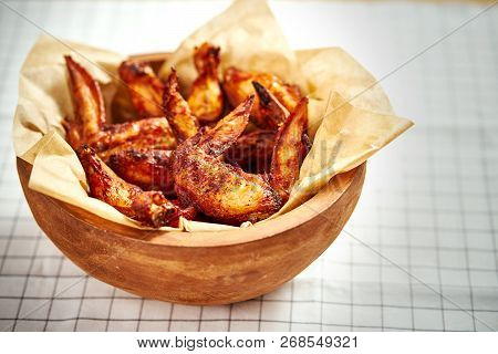 Delicious Fried Chicken Wings In A Bowl On A Checkered Tablecloth
