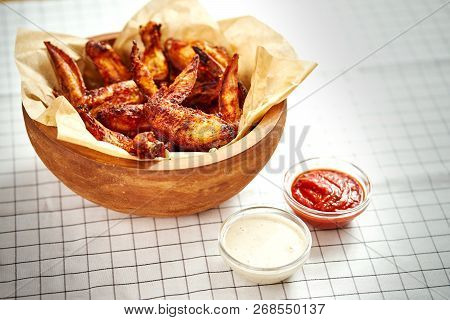 Delicious Fried Chicken Wings In A Bowl On A Checkered Tablecloth