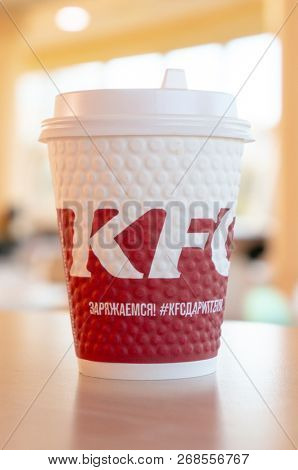Moscow, Russia, October 11, 2018 : Coffee in paper cups with KFC logo on the table at KFC