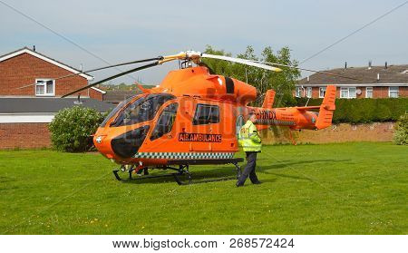 St Neots, Cambridgeshire, England - April 30, 2017:  Cambridgeshire  Air Ambulance Helicopter  Lande