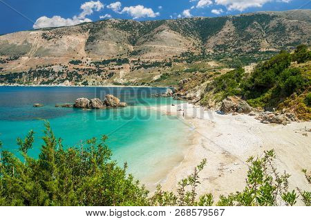 Vouti Beach, Kefalonia Island, Greece. People Relaxing At The Beach. The Beach Is Surrounded By Flow