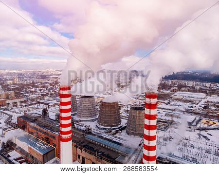 Aerial Top View Clouds Of Smoke And Steam Cooling Tower Industrial Heat Electro Central Coal. Enviro