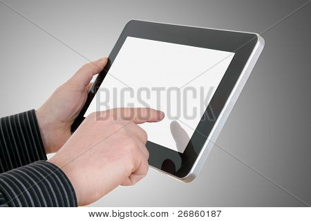 mains d'homme d'affaires avec touchent pad sur fond gris
