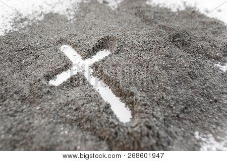 Christian Cross Or Crucifix Drawing In Ash, Dust Or Sand As Symbol Of Religion, Sacrifice, Redemtion
