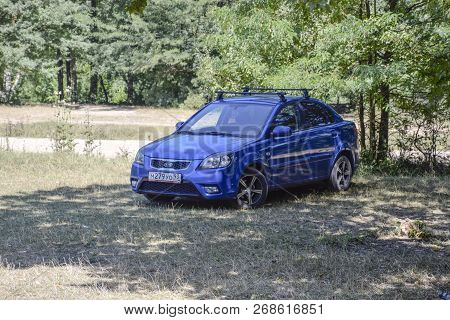 Forests Next To The Village Of Shapsugskaya, Russia - July 30, 2016: The Blue Car Of Kia Rio Is Unde