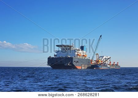 The Cargo Ship With The Crane. Pipelaying Barge.