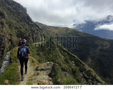 Cusco Province, Peru - May 8th, 2016: A Young Group Of International Hikers, Led By Their Local Inca