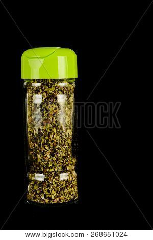 Close-up Of Oregan Spice Bottle Object On A Black Background