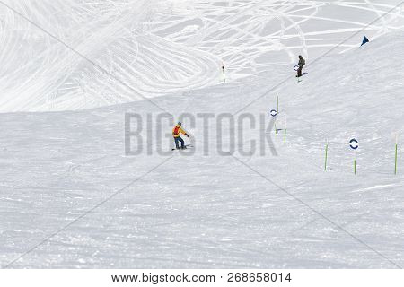 Skiers And Snowboarders Downhill On Snowy Ski Trace At Sun Cold Day. Caucasus Mountains In Winter, G