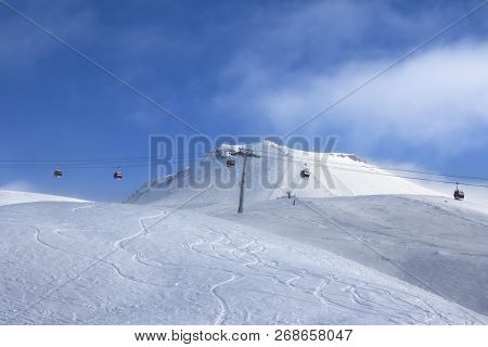 Gondola Lift And Off-piste Ski Slope In Fog At Nice Sunny Evening. Caucasus Mountains In Winter, Geo