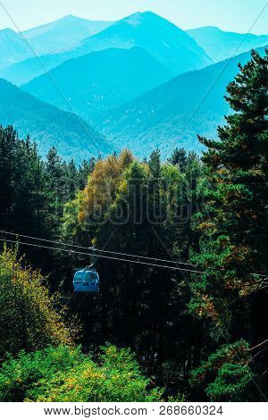 Gondola Rope Way In The Mountains. Alpine Cable Cabin Lift, Landscape With Funicular.