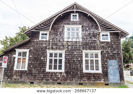 Puerto Varas, Chile - Mar 1, 2015: Old Wooden House With Cultural Center In Puerto Varas.